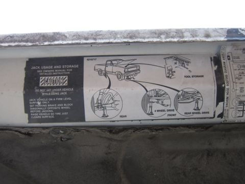 1987 Dodge 1500 - This diagram illustrates proper jack usage and tool storage for a pickup truck, detailing different jacking points.