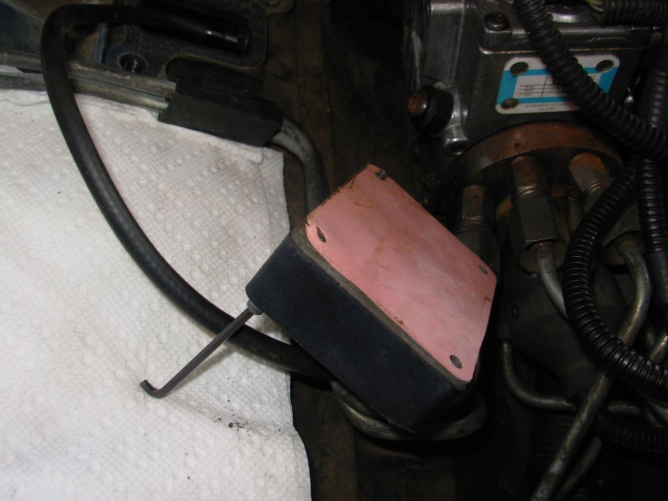 Some PMDs have thermal grease, but mine has this reusable silicone pad.

The paper towel keeps screws & tools from falling into the head's intake ports.