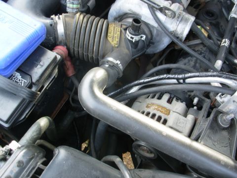 1997 Chevrolet Silverado 3500 - I ran it down beside the battery, where the slack is stored (in case I want to move it somewhere else), and then it runs thru the core supp…
