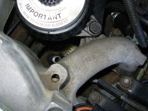 1997 Chevrolet Silverado 3500 - The factory '97 OPS bore is angled just enough to intersect the intake. That's a 4"-long 1/4" pipe nipple screwed into the block. Fuel filt…