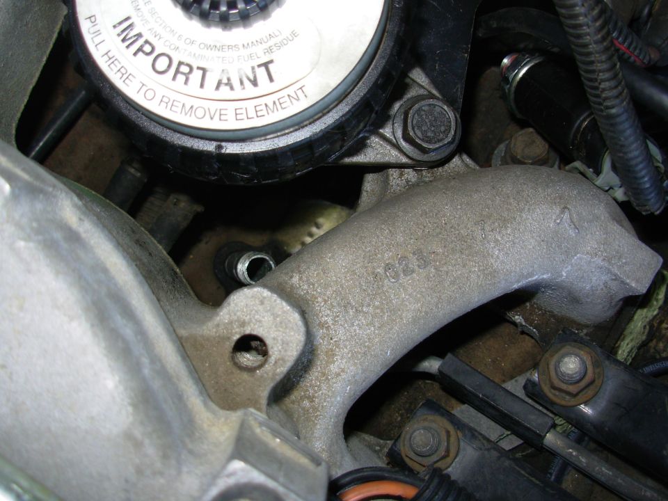 The factory '97 OPS bore is angled just enough to intersect the intake.  That's a 4"-long 1/4" pipe nipple screwed into the block.

Fuel filter is a Mann from [url=http://www.amazon.com/gp/product/B0027EVCEK/]Amazon[/url].