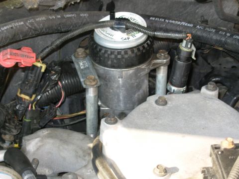 1997 Chevrolet Silverado 3500 - One last trip to the hardware store to get these 4"-long 3/8" pipe nipples, and a 1" EMT 1-hole conduit strap (flattened & drilled). The FF…