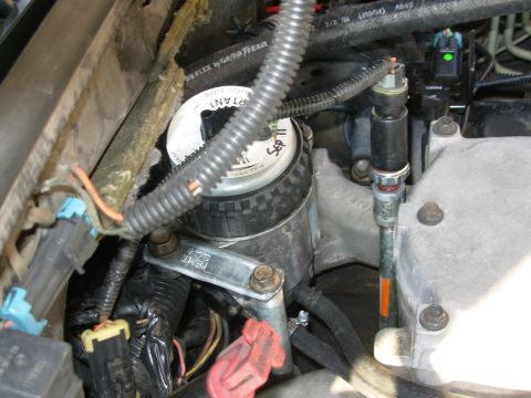 1997 Chevrolet Silverado 3500 - The short bolt in the FFM is one of its originals, with a spare nut. The strap is necessary to rotate the FFM so the outlet & drain nipples…
