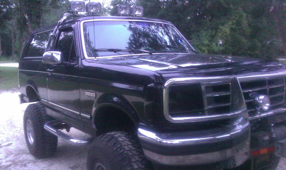 1993 Ford Bronco, lifted with off-road lights on roof