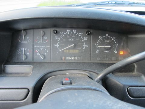 2001 Ford Crown Victoria - Interior view of dashboard gauges, including speedometer, tachometer, fuel, and temperature gauges.