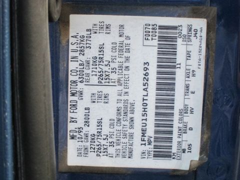2001 Ford Crown Victoria - Ford manufacturer's certification/data plate showing VIN, gross weight ratings, tire/rim specs and paint codes.
