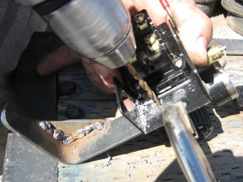 1972 Ford F-250 - Drilling a hole in a metal bracket that is attached to an electrical component.