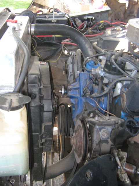 1972 Ford F-250 - Close-up view of an engine bay, showing the radiator, fan, and various engine parts.