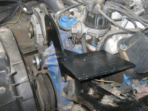 1972 Ford F-250 - Custom bracket installed in engine bay, alternator and distributor components.