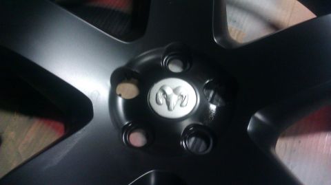 2006 Dodge Charger - This is a close-up of a black wheel the Ram logo.