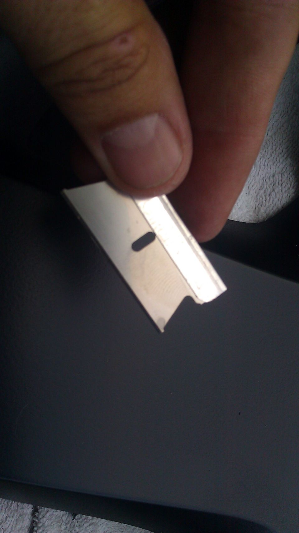 I first tried an Xacto knife, but It wanted to skip, or grip, as I cut.  This blade did the job, notice the end has a different edge than the normal razor blade, thats the key to a smooth cut.
