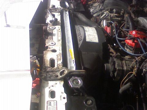 1987 Mercury Grand Marquis - Close-up view of the engine bay of a 1987 Mercury Grand Marquis, highlighting the radiator and fan assembly.