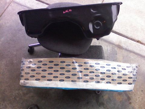 1987 Mercury Grand Marquis - Ford oil pan and air filter are shown together. The oil pan has 'LKG' written on it.