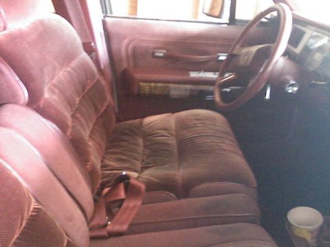 1987 Mercury Grand Marquis - Interior view of a 1987 Mercury Grand Marquis, highlighting the velour upholstery and door trim.