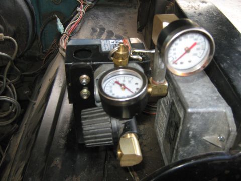 1972 Ford F-250 - This image shows an air pressure regulator with gauges, possibly installed in a vehicle's engine bay or undercarriage.