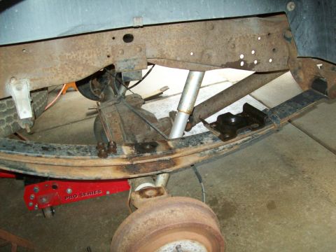 1993 Ford F-150 - Close-up view of the rear leaf spring suspension and frame of a 1993 Ford F-150.