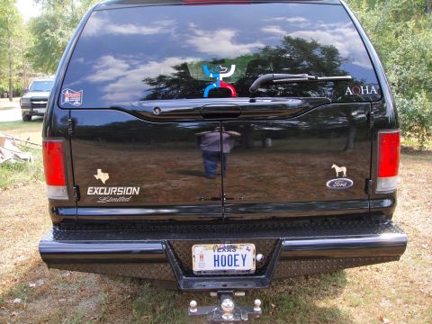 2005 Ford Excursion - Rear view of a black SUV, identified as an Excursion Limited, with a Texas license plate.