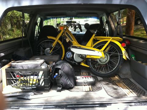 1981 Garelli Rally Sport - Yellow moped loaded into the back of an SUV, with other items for transport.