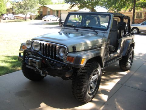 2005 Jeep Wrangler - This 2005 Jeep Wrangler Rubicon features a winch and is shown in a driveway setting.