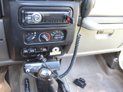 2005 Jeep Wrangler - Interior view of a 2005 Jeep Wrangler, a CB radio and gear shift.