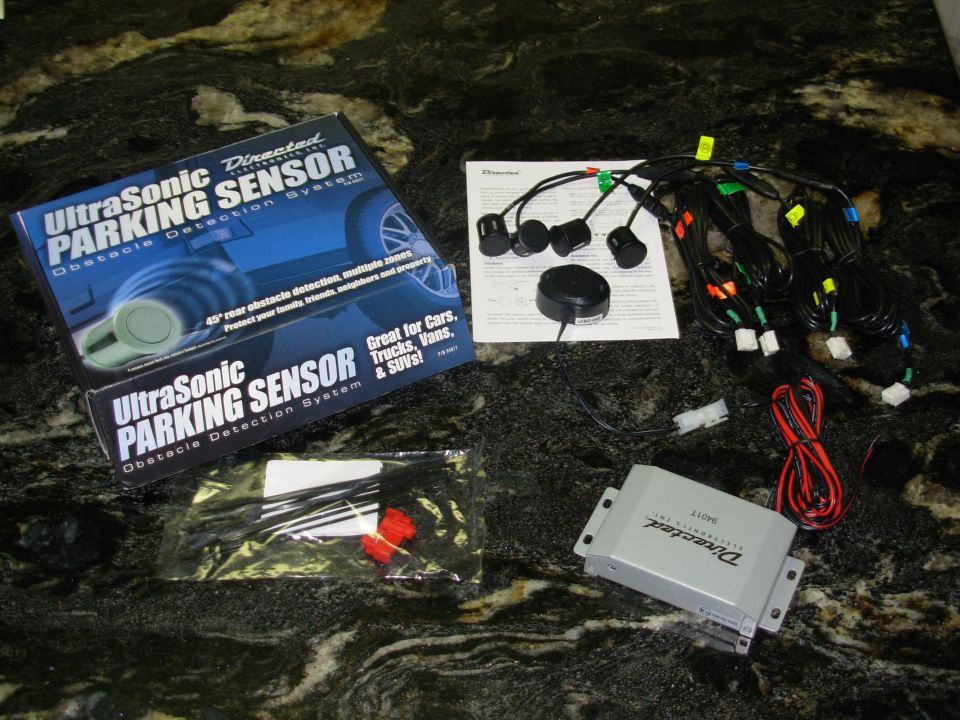 I haven't backed into anything yet, but I'm driving the truck more, and Lisa might also drive it some when we travel, so I'm adding this [url=https://www.amazon.com/dp/B000FIH7QC]Directed 9401T[/url] beep-only sensor system (I didn't get the optional display).  It was ~$150 retail, but I got a hookup from a local shop that installs them.  I knew before buying it that the sensor wires wouldn't be long enough, so I bought some RCA cables, cut them up, and soldered them into these cables.

UPDATE: It has been working perfectly for several years.