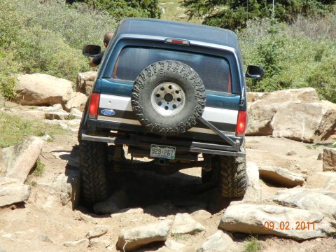 1996 Ford Bronco - This 1996 Ford Bronco navigates a challenging rocky trail, its off-road capabilities.