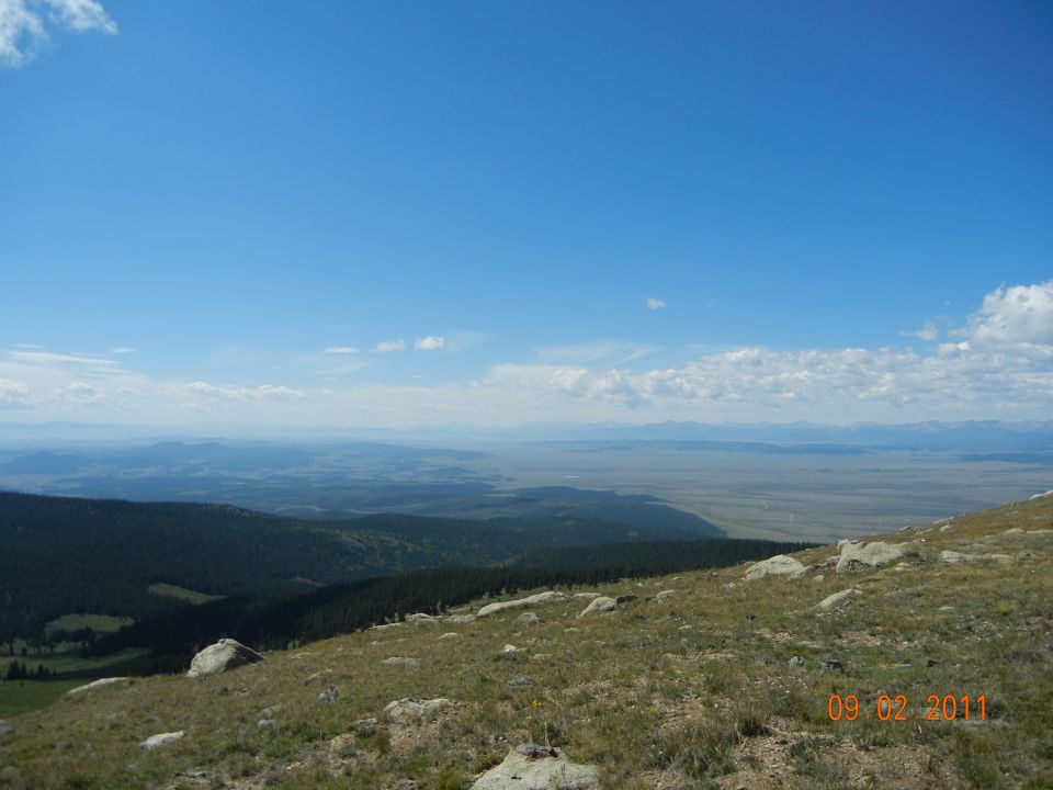 Mountain landscape with a wide view of plains and sky, dated 09/02/2011