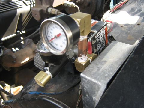 1972 Ford F-250 - Engine bay components include pressure gauges and brass fittings, with visible wiring and metal surfaces.