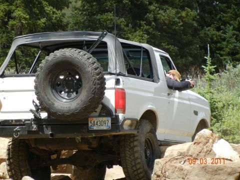 1996 Ford Bronco - This 1996 Ford Bronco navigates a challenging off-road course with a driver looking out the window.