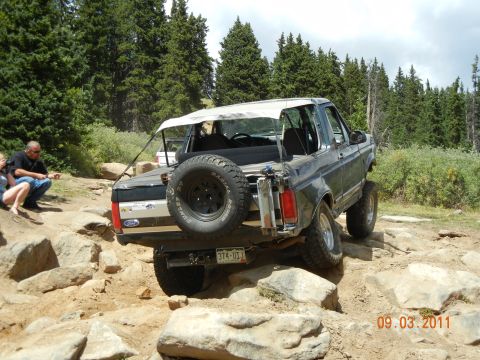 1996 Ford Bronco - This Ford Bronco navigates a challenging rocky terrain, its off-road capabilities.