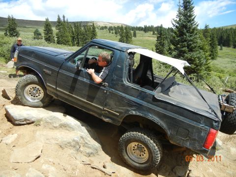 1996 Ford Bronco - 1996 Ford Bronco tackling rocky terrain on an off-road adventure.