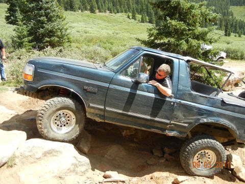 1996 Ford Bronco - This 1996 Ford Bronco navigates a challenging rocky terrain during an off-road excursion.