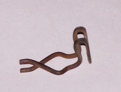1973 Ford Bronco - A single metal clip is shown against a plain background.
