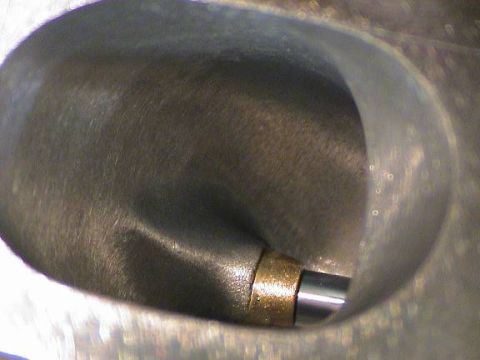 1979 Ford Bronco - Close-up view of an engine cylinder head, showing internal components.