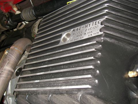 1990 Ford Bronco - Close-up of a MAG-HYTEC transmission pan, showing model number and manufacturing details.
