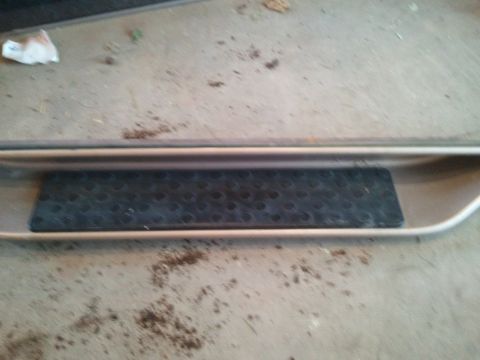 1996 Ford Bronco - Close-up of a vehicle's running board and step pad.