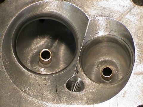 1979 Ford Bronco - Take a close look at the intake port where the valve comes though look at the ridge dividing the flow