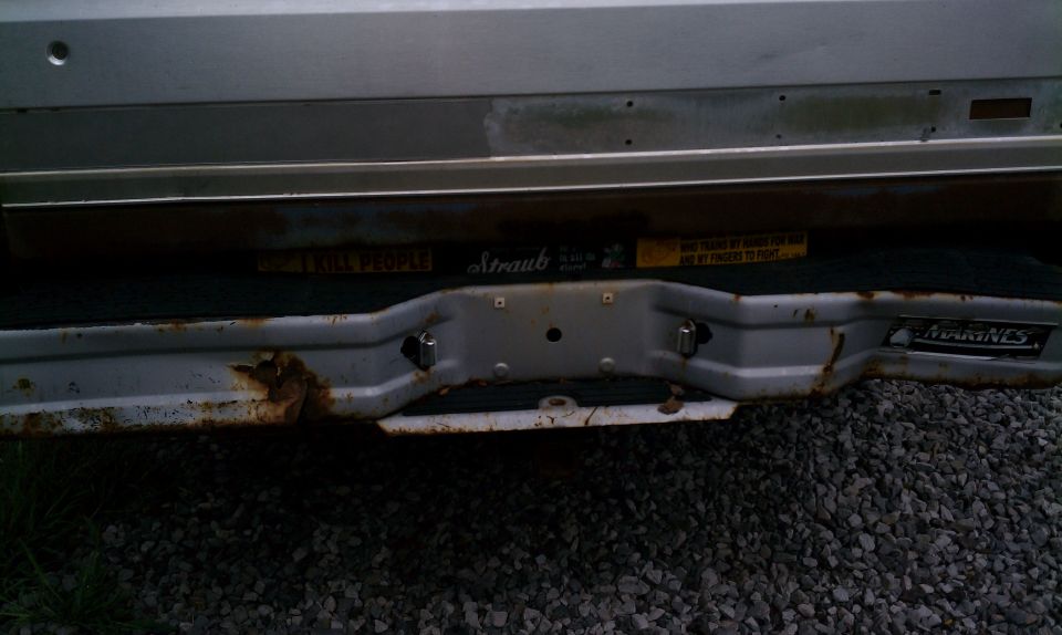 Original bumper and tailgate, bumper being replaced with chrome diamond plate bumper.