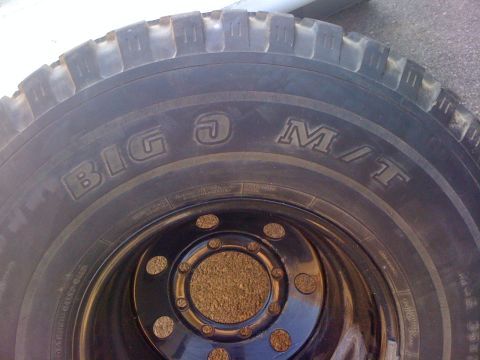 1987 Suzuki Samurai - This photo shows a tire with "BIG O M/T" text on its sidewall, not a 1987 Suzuki Samurai.