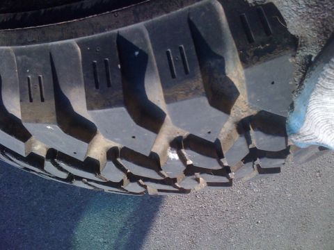 1987 Suzuki Samurai - The tread pattern on this tire features large, aggressive blocks designed for off-road traction.