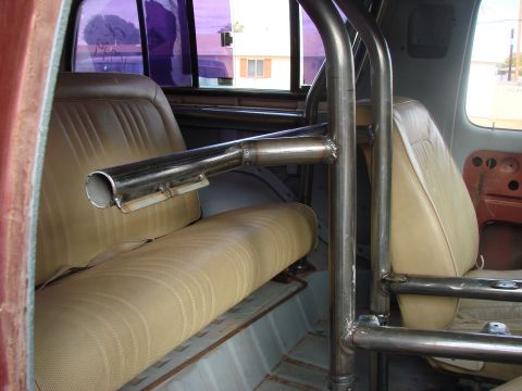 1979 Ford Bronco - Custom roll cage installed in the interior of a 1979 Ford Bronco, showing tan seats.
