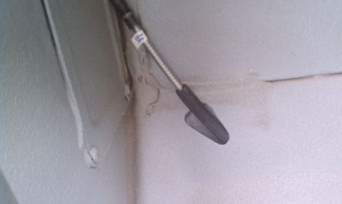 1979 Ford Bronco - Close-up view of a parking brake lever, showing a label with some text.