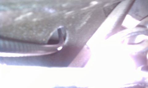 1979 Ford Bronco - A close-up view of a vehicle component, showing a metallic surface with a distinct opening. The Supermotors.net watermark is present.