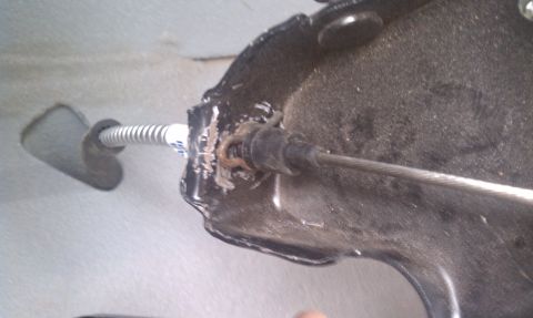 1979 Ford Bronco - Close-up of a parking brake cable assembly, showing the cable and housing.