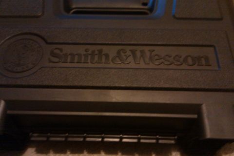 2000 Mercury Grand Marquis - A black gun case with the Smith & Wesson logo embossed on the lid.
