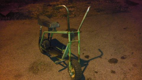 1989 Ford Bronco - This mini bike appears to be old and in need of restoration.
