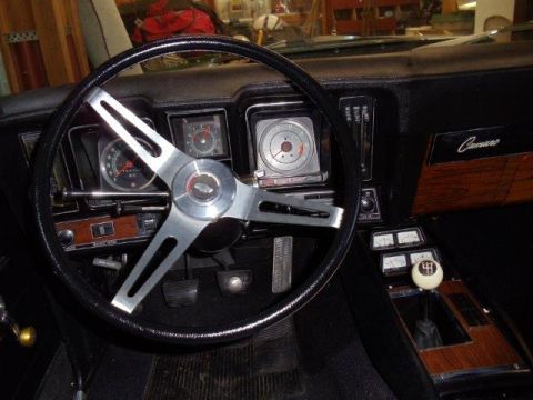 1969 Chevrolet Camaro - The interior of a 1969 Chevrolet Camaro shows its dashboard, steering wheel, and center console.