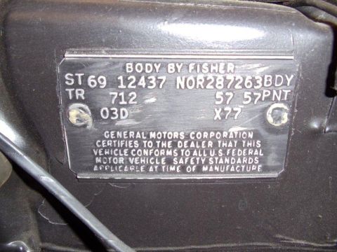 1969 Chevrolet Camaro - A close-up of a vehicle identification plate shows manufacturing details and compliance information.