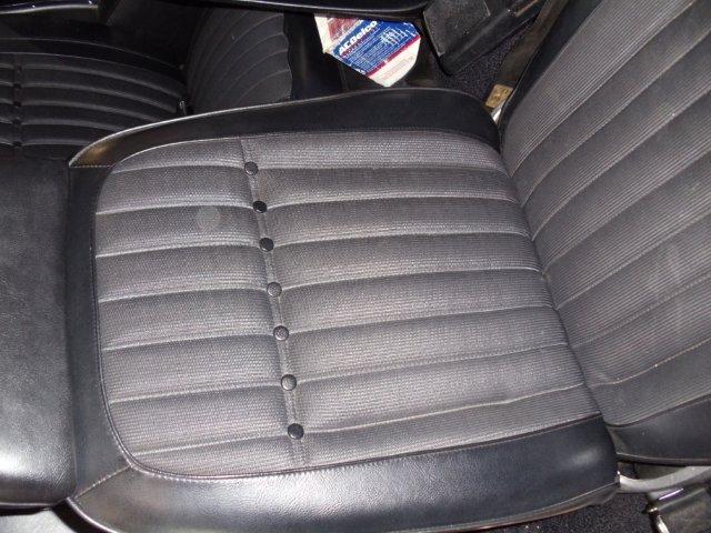 1969 Chevrolet Camaro interior with patterned seats and an ACDelco box