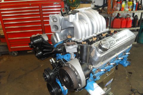 1997 Ford Ranger - Ford V8 engine with Ford Racing valve covers and aluminum intake manifold in a workshop setting.